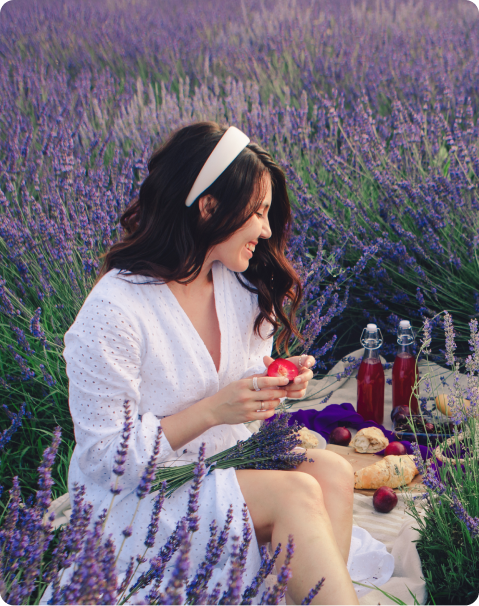 Woman relaxing in lavender field representing calm and recovery from eating disorders through therapy