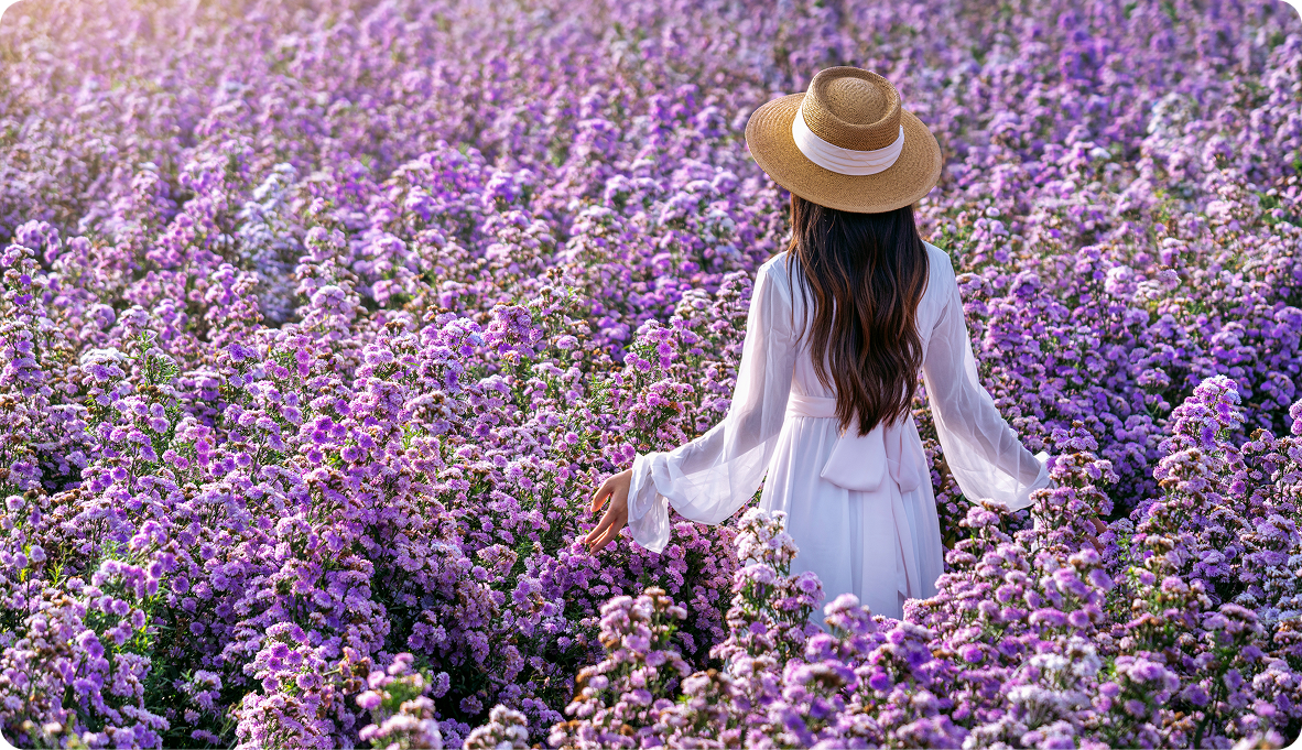 Woman in peaceful field representing healing from divorce grief and major life transitions through therapy
